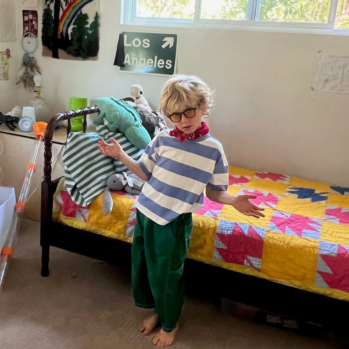 Child in a colorful bedroom with toys and decorations