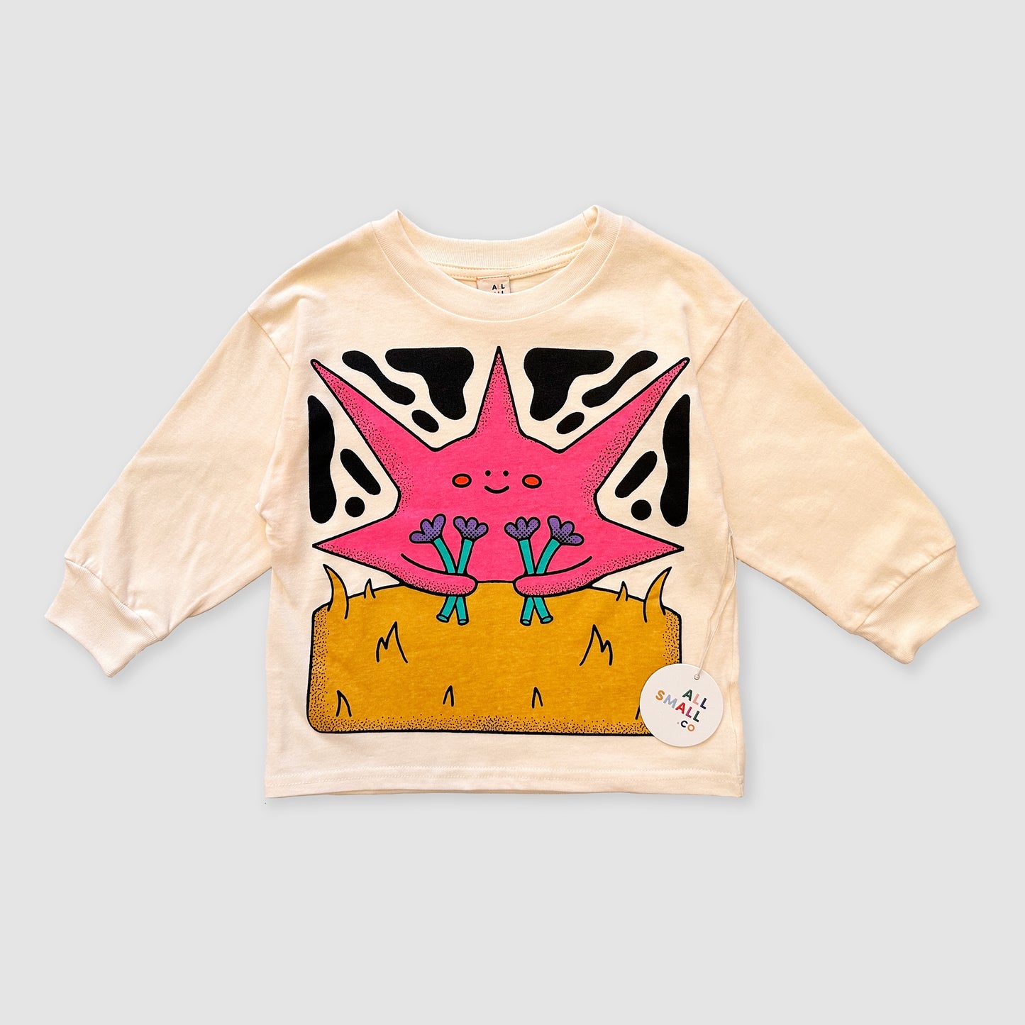 Beige long-sleeve shirt with a pink starfish design on a light gray background