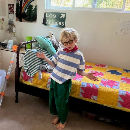 Child in a colorful bedroom with toys and decorations